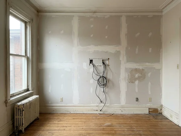 Before: bare living room wall in Trinity Bellwoods
