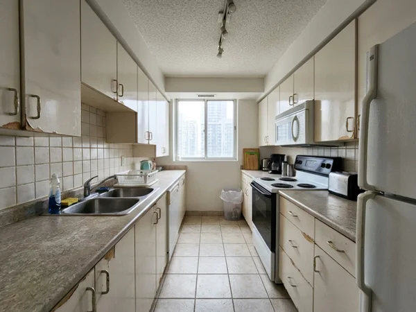 Before: builder-grade condo galley in Yorkville
