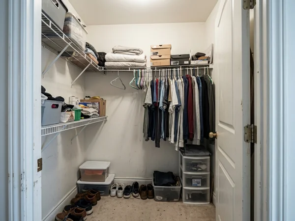 Before: wire-shelf condo closet in Liberty Village
