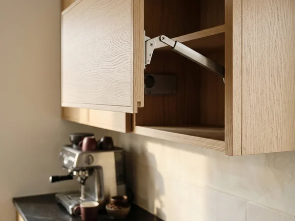 Blum Aventos lift-up door on a white oak upper cabinet