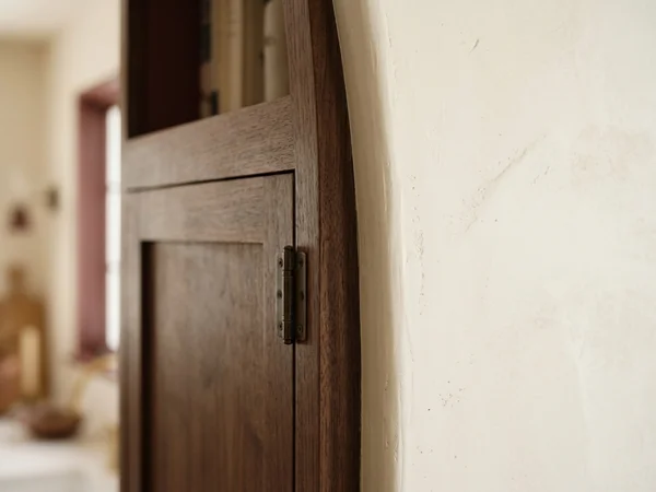 Inset face frame scribed tight to a bowed wall