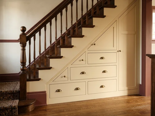 Under-stair built-in drawers painted to match trim