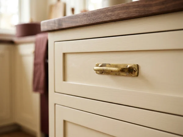 Brass pulls on painted Shaker drawers